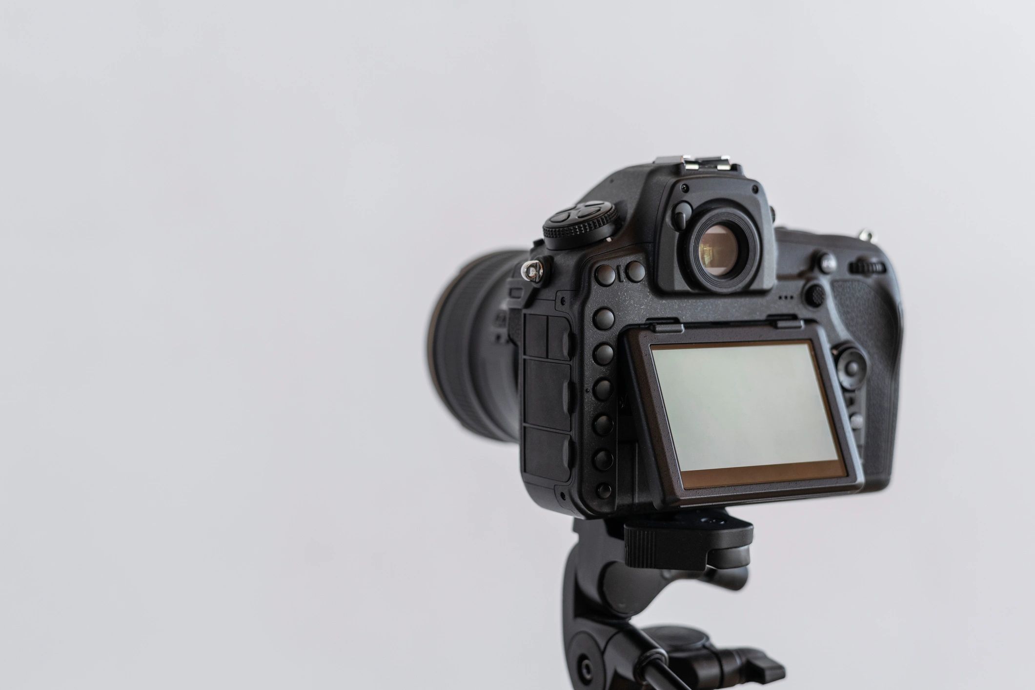 Digital camera on a tripod in a studio