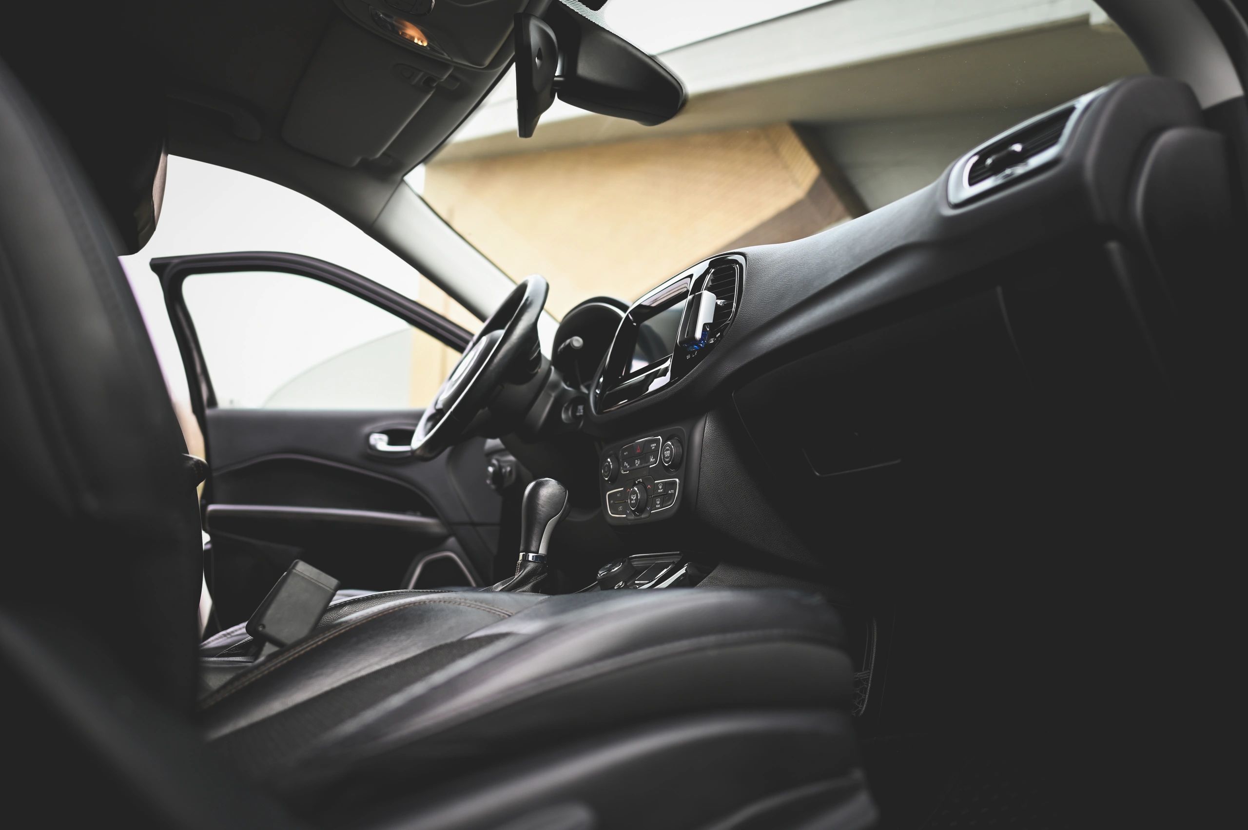 Modern car interior with dashboard and leather seats