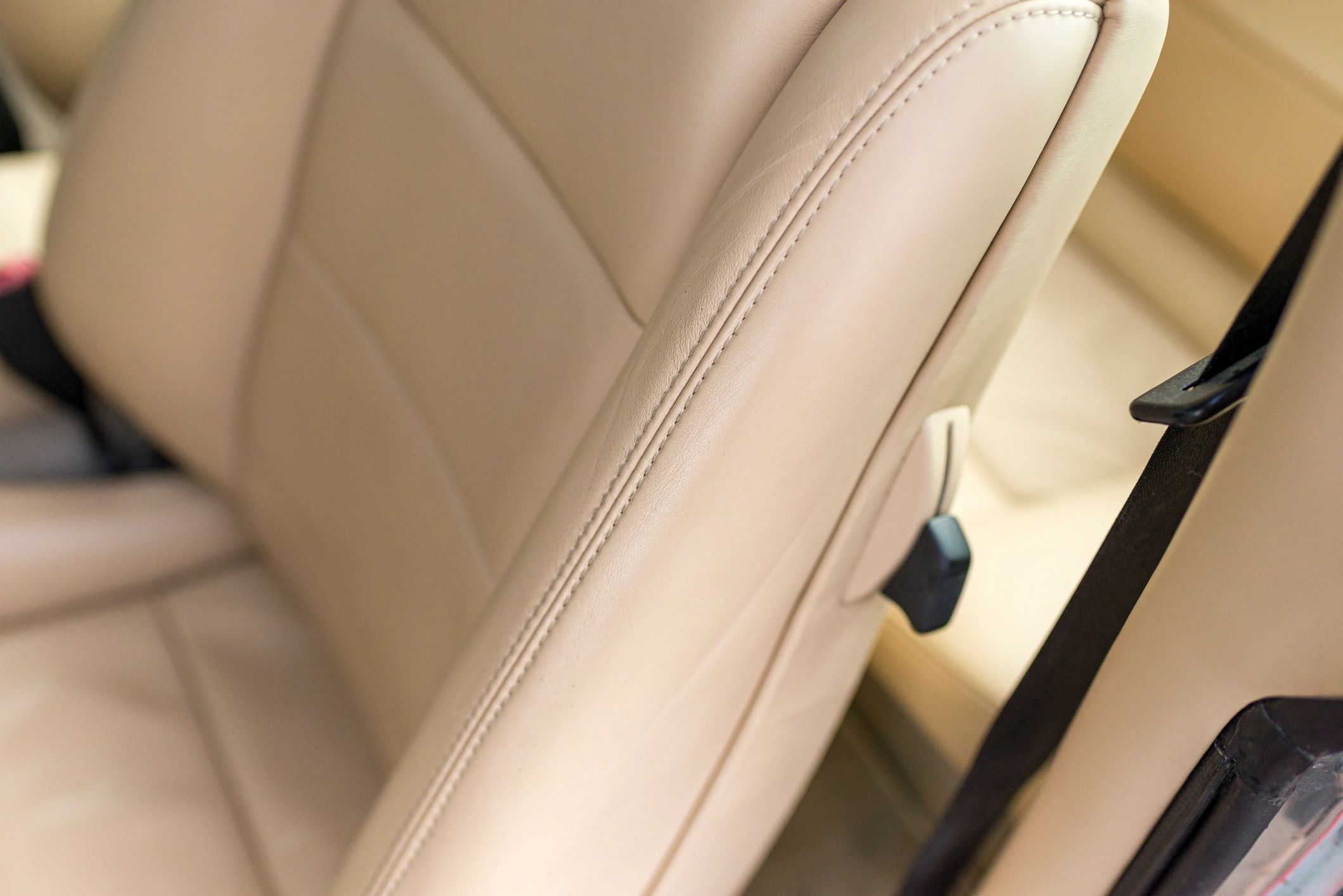 Beige leather car seat detail