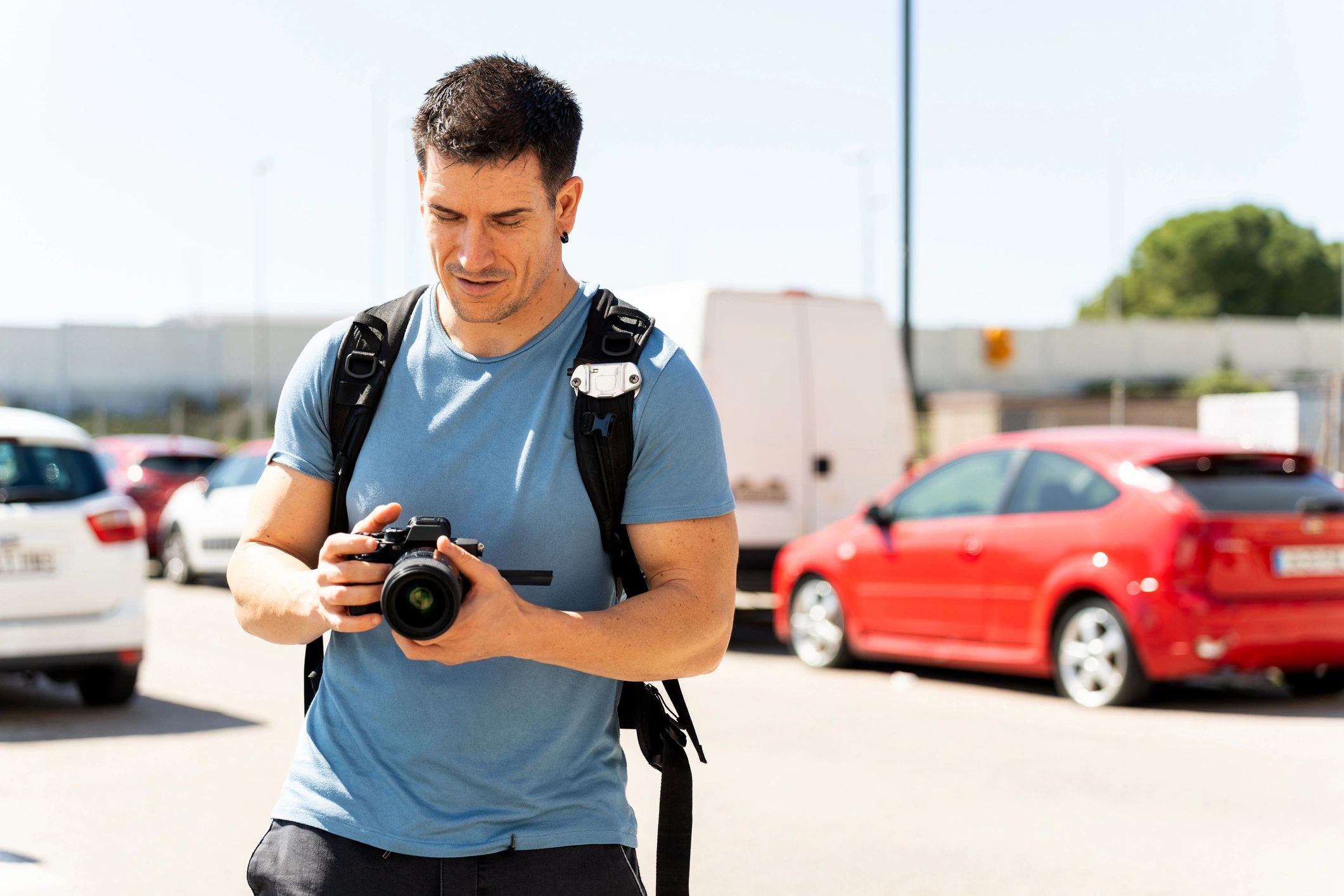 Photographer reviewing images on camera during an outdoor shoot